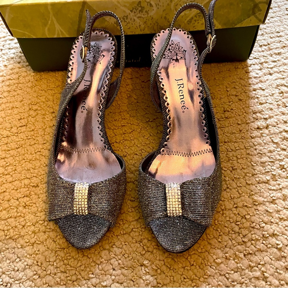 Silver shoes with peep toe & rhinestone bow. 2.5” heel.  Excellent condition.